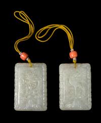 A Pair of White Jade 'Dragon and Phoenix' Plaques Length of each 2 1/4 inches. — 19TH CENTURY