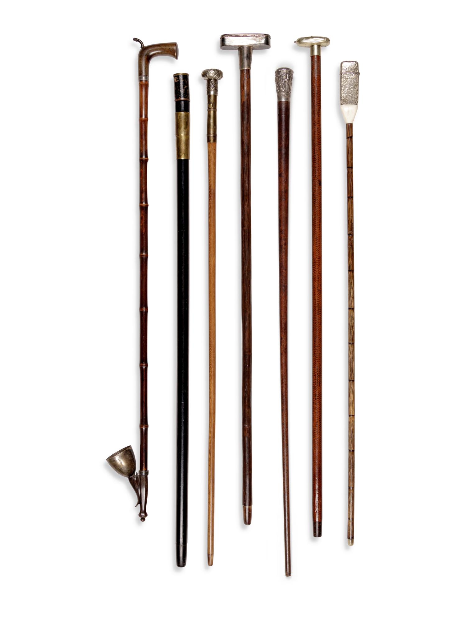 Seven Silvered Metal and Brass Mounted Smoker's System Walking Sticks