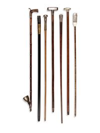 Seven Silvered Metal and Brass Mounted Smoker's System Walking Sticks