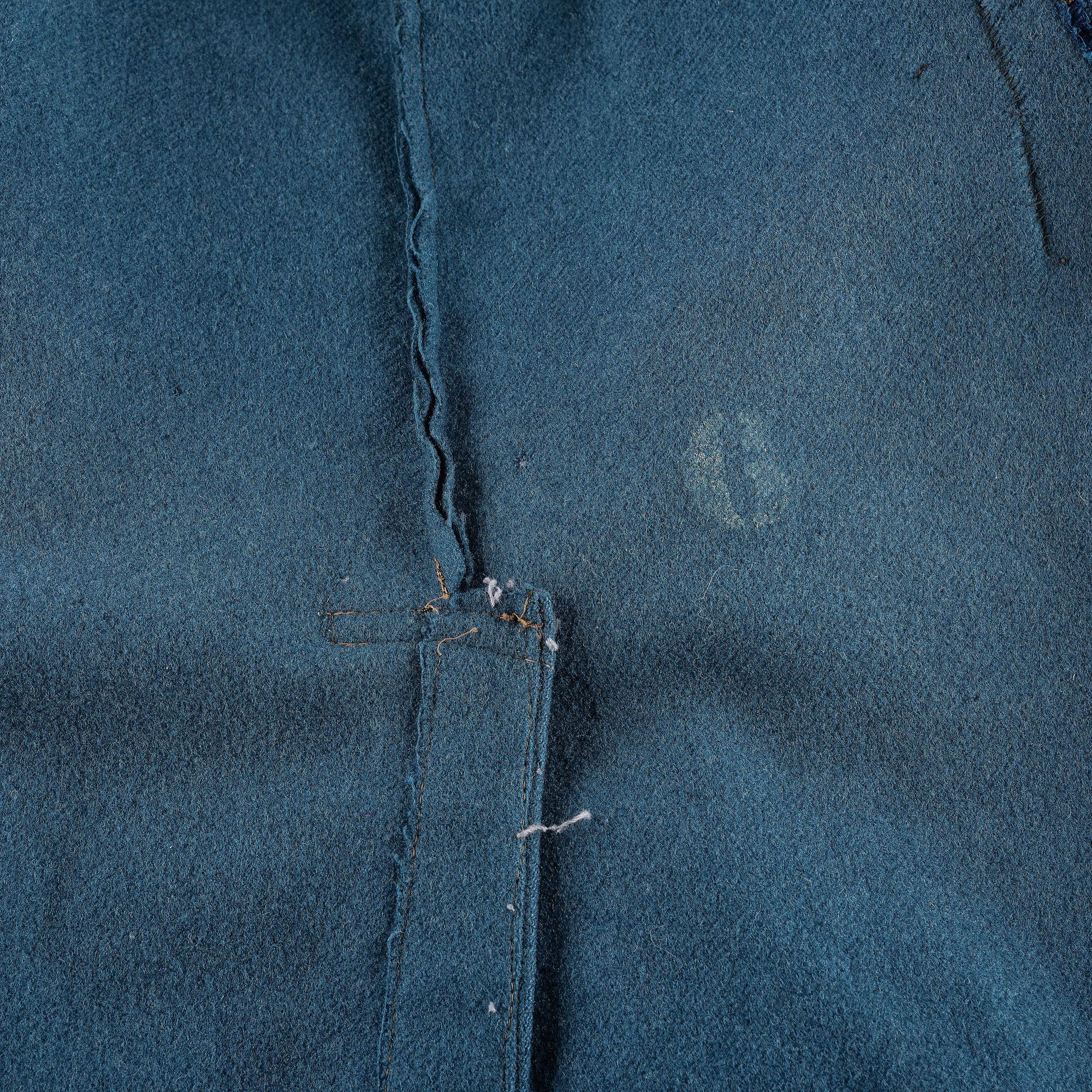 [MILITARIA]. Civil War-era enlisted overcoat with modifications.