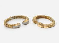 A Pair of Matching 18K Yellow Gold Bangle Bracelets with Diamonds