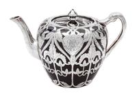 A Porcelain Silver Overlay Teapot Height 5 1/4 inches.
