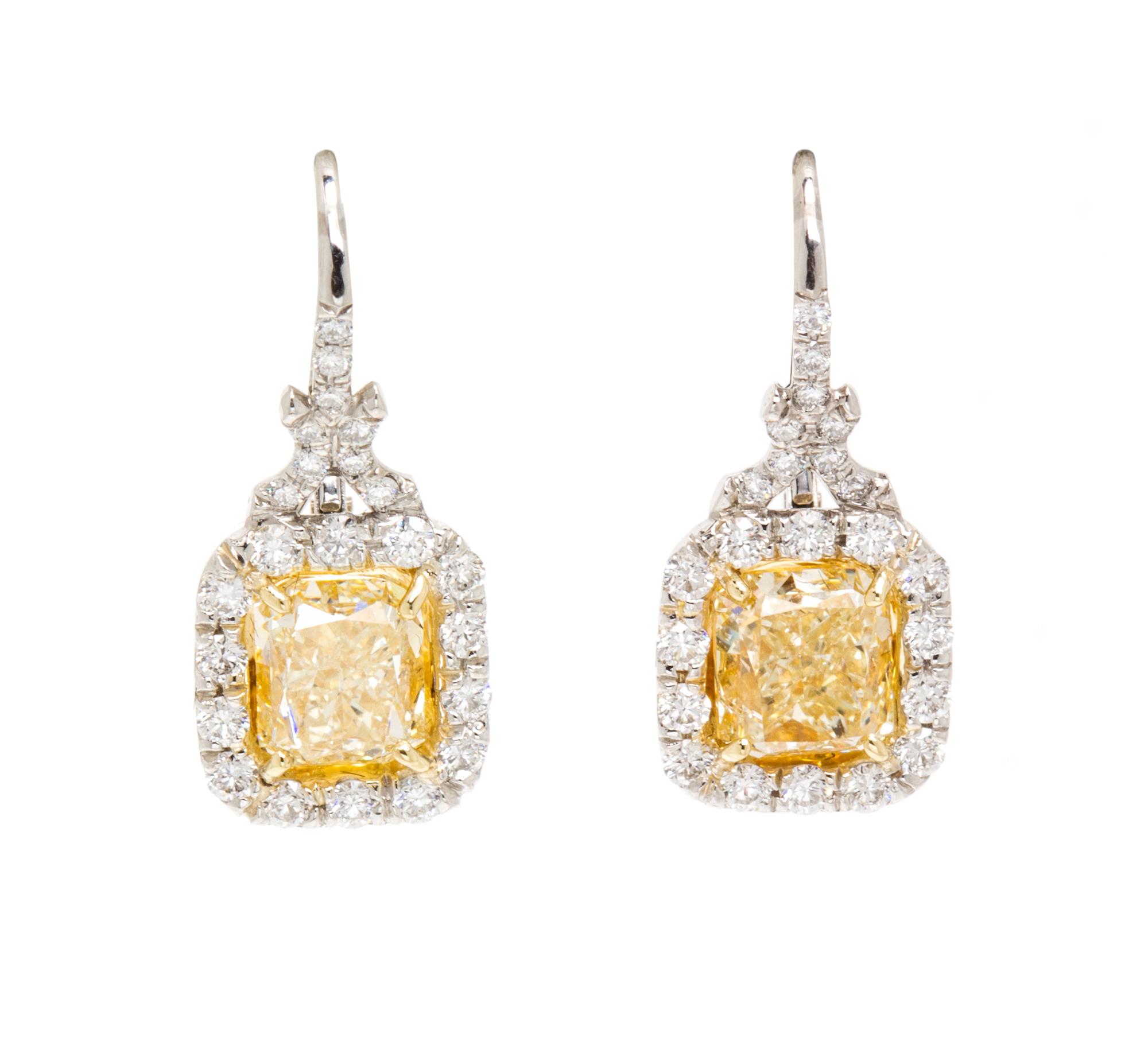 A Pair of Platinum, Yellow Gold, Fancy Intense Yellow Diamond and Diamond Earrings, 4.20 dwts.