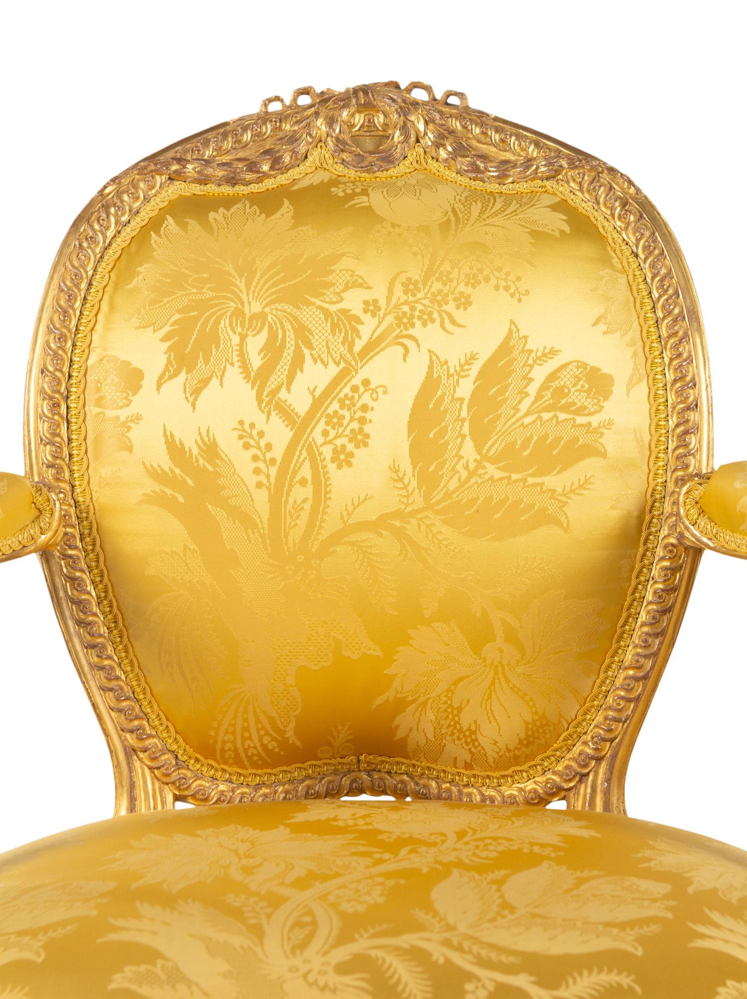 A Pair of George III Carved Giltwood Armchairs