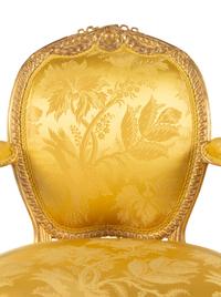 A Pair of George III Carved Giltwood Armchairs