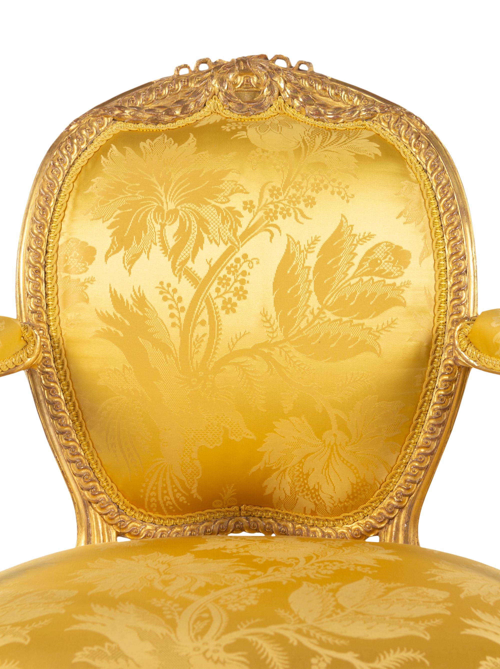 A Pair of George III Carved Giltwood Armchairs