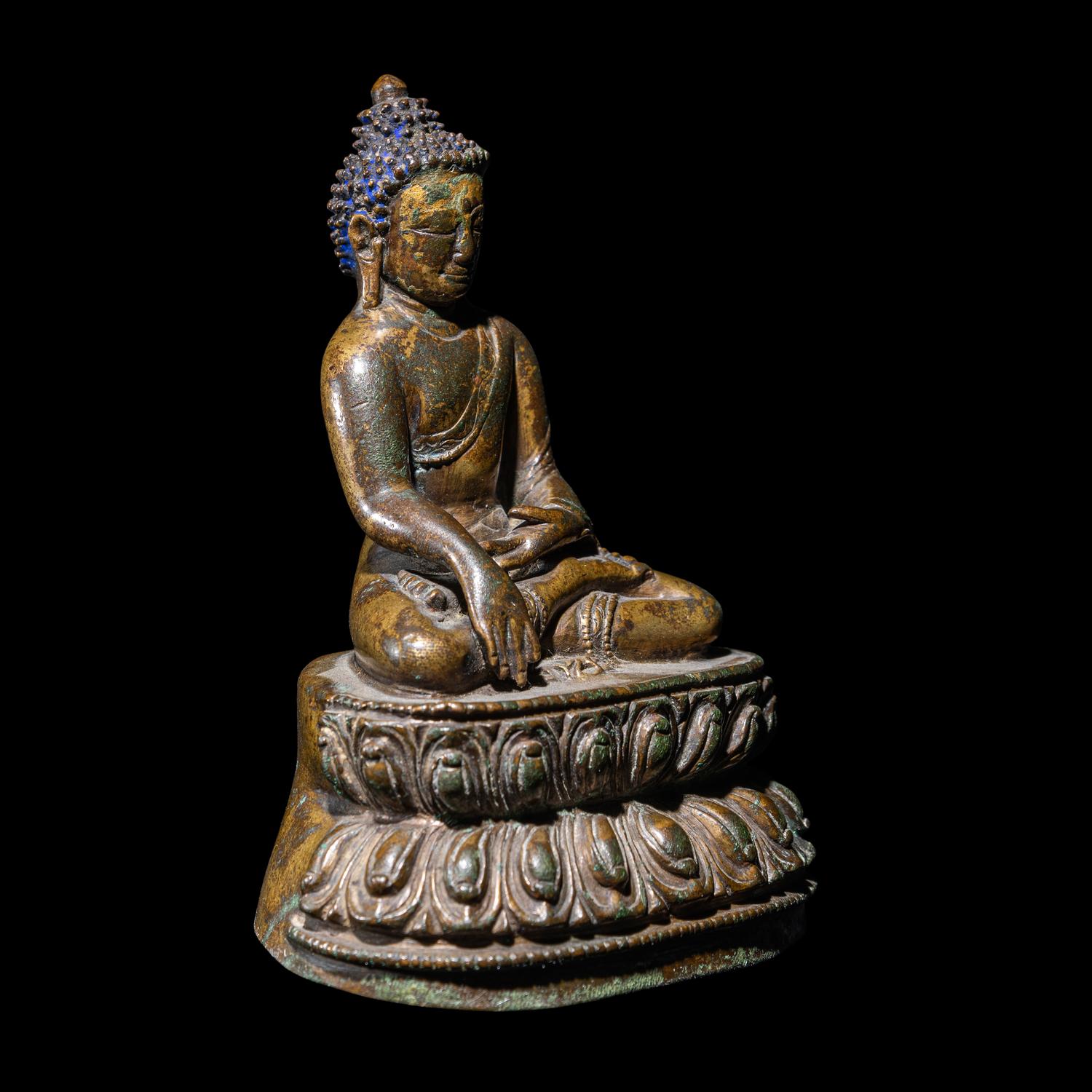 A Tibetan Gilt Copper Alloy Figure of Buddha Shakyamuni, 14th/15th Century 十四/十五世紀 西藏銅鎏金坐佛