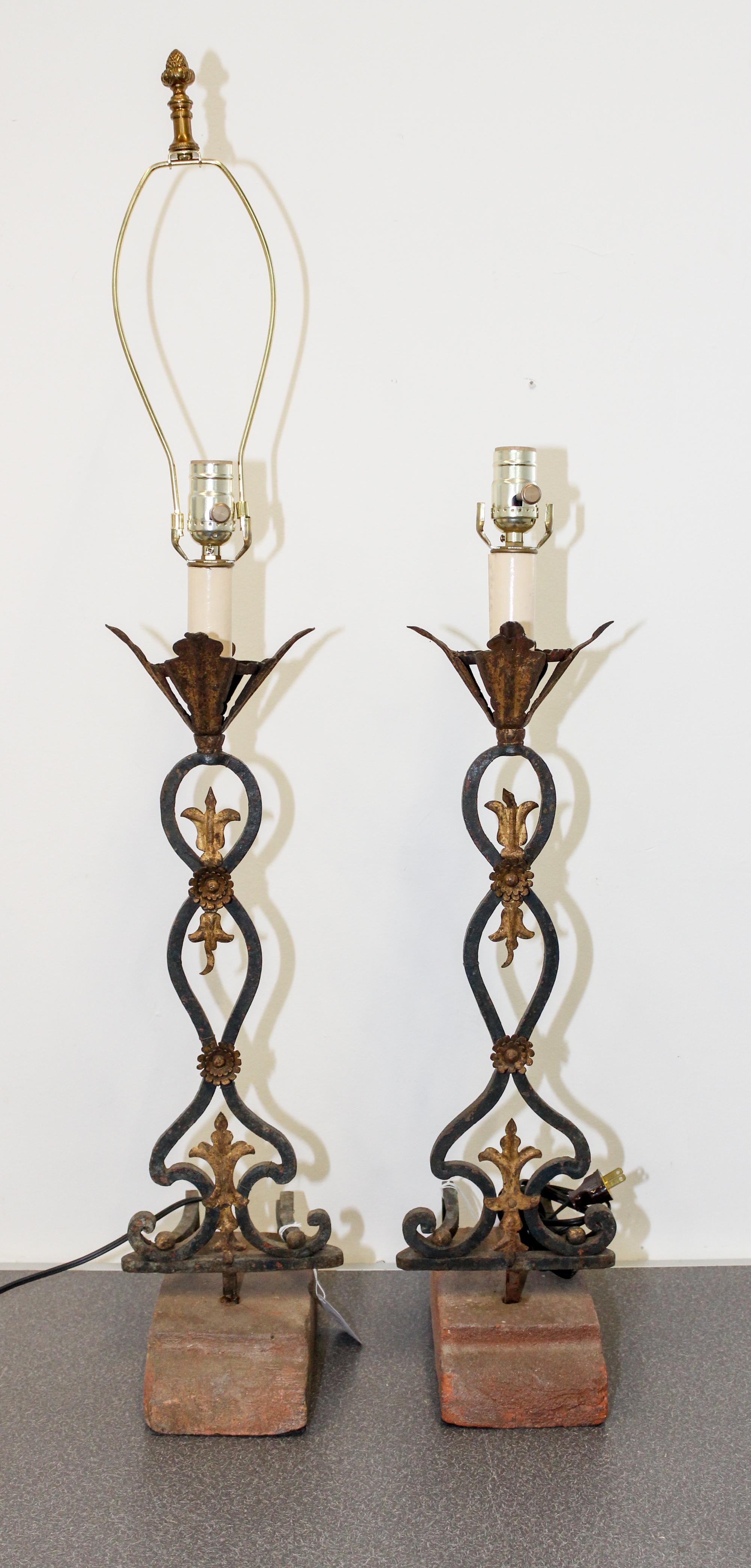 A Pair of Iron and Tole Lamps Height 29 inches. — 20TH CENTURY