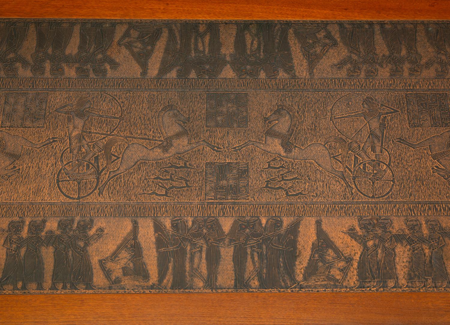A Scandinavian Modern Teak Low Table with Egyptian Motif Stamped Copper Top