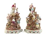 A Pair of Continental Porcelain Figural Groups, Height 20 inches.