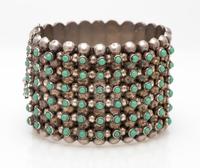 A Sterling Silver and Turquoise Dot Bangle Bracelet, Pre-1948, 49.20 dwts.