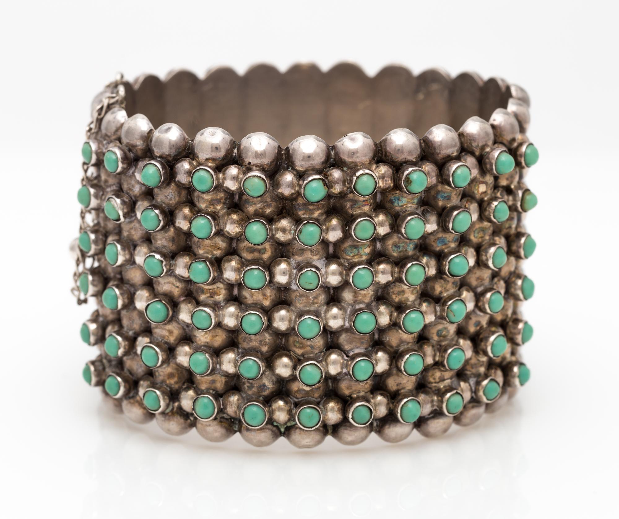 A Sterling Silver and Turquoise Dot Bangle Bracelet, Pre-1948, 49.20 dwts.