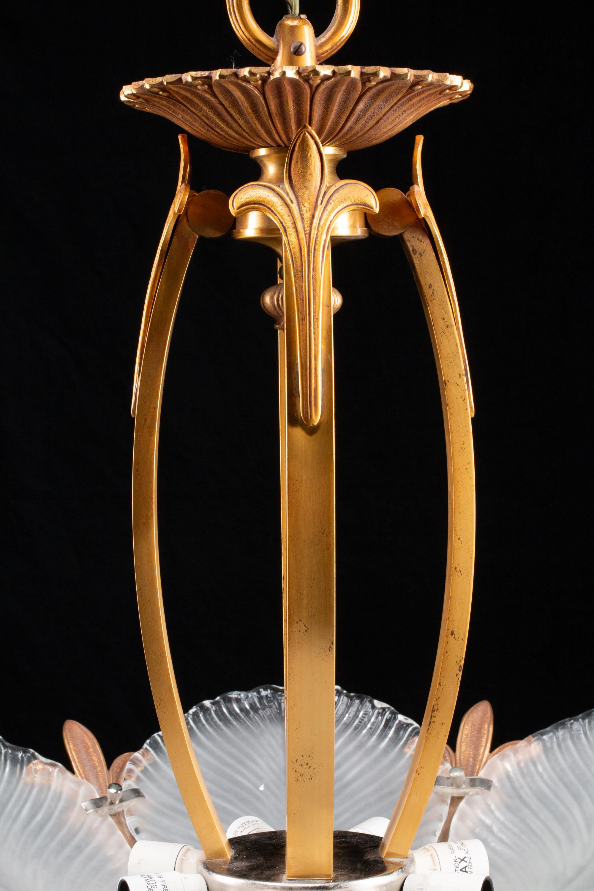 An Art Nouveau Style Gilt-Bronze and Frosted Glass Eight-Light Chandelier