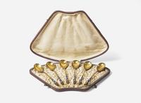 A cased set of six Russian silver gilt and shaded enamel spoons, maker's mark indistinct, Assay master Anatoly Apollonovich Artsybashev, Moscow, 1894