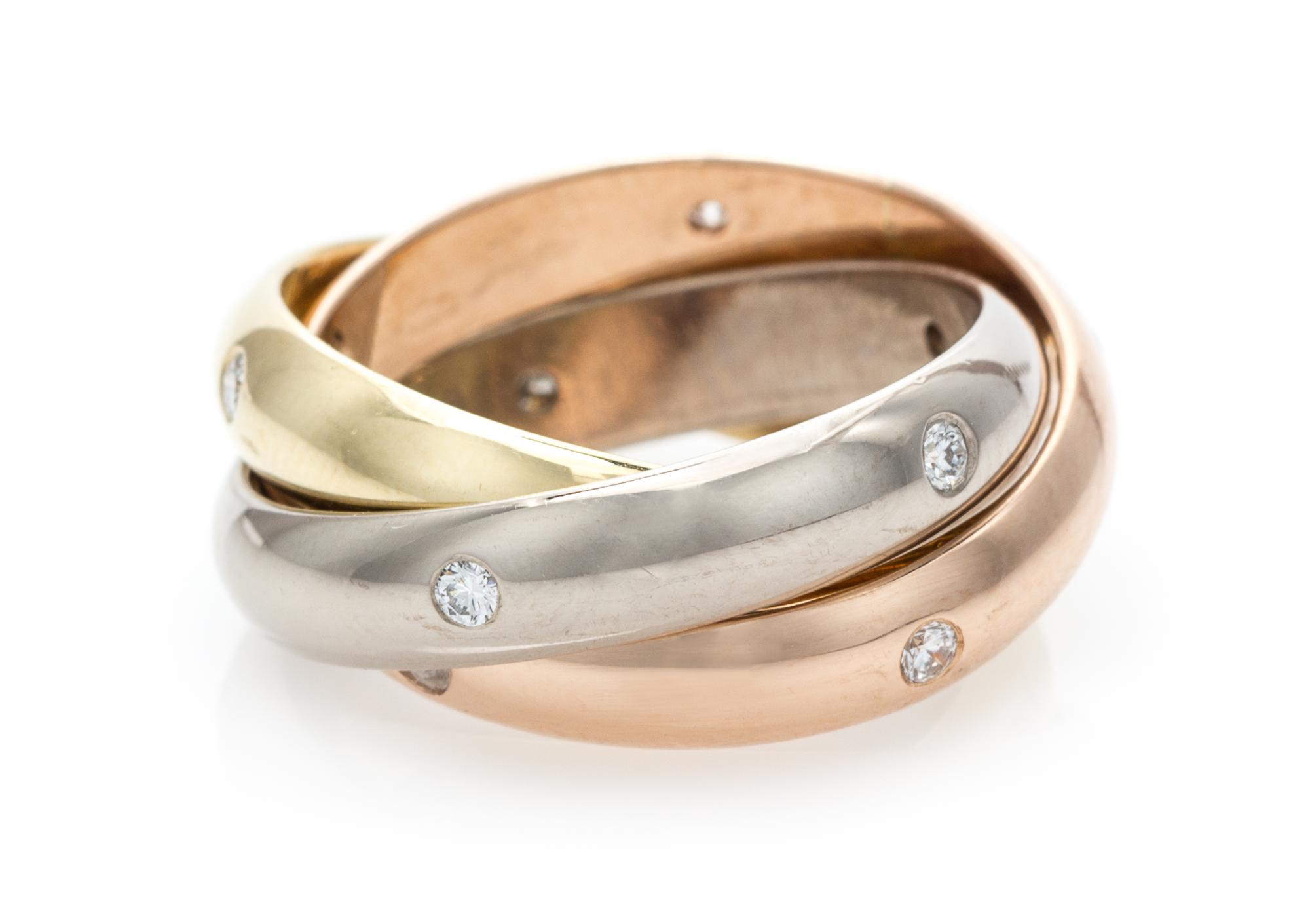 An 18 Karat Tricolor Gold and Diamond Trinity Ring, Cartier, 6.80 dwts.
