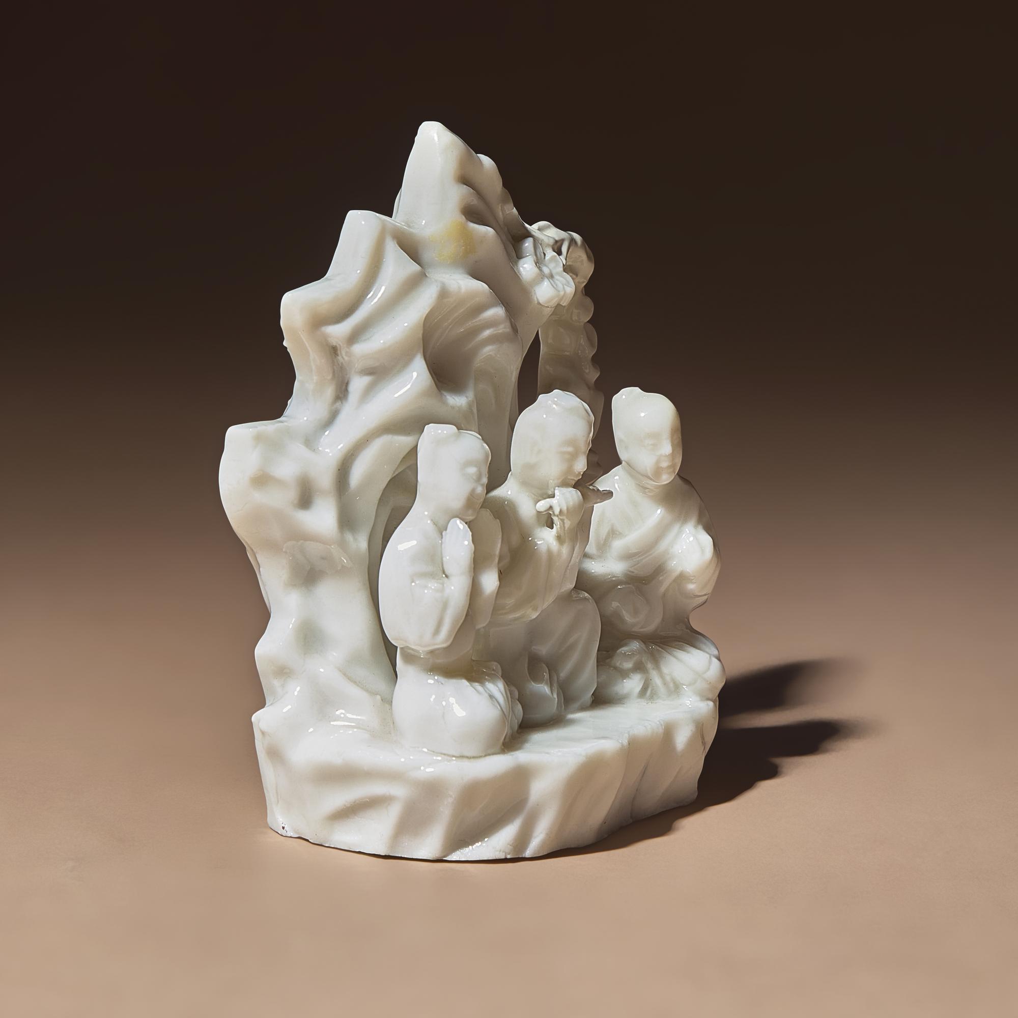 A Chinese Blanc-de-Chine Porcelain Figural Group of Three Musicians, 18th Century — 清中期 德化白瓷塑吹奏圖山子