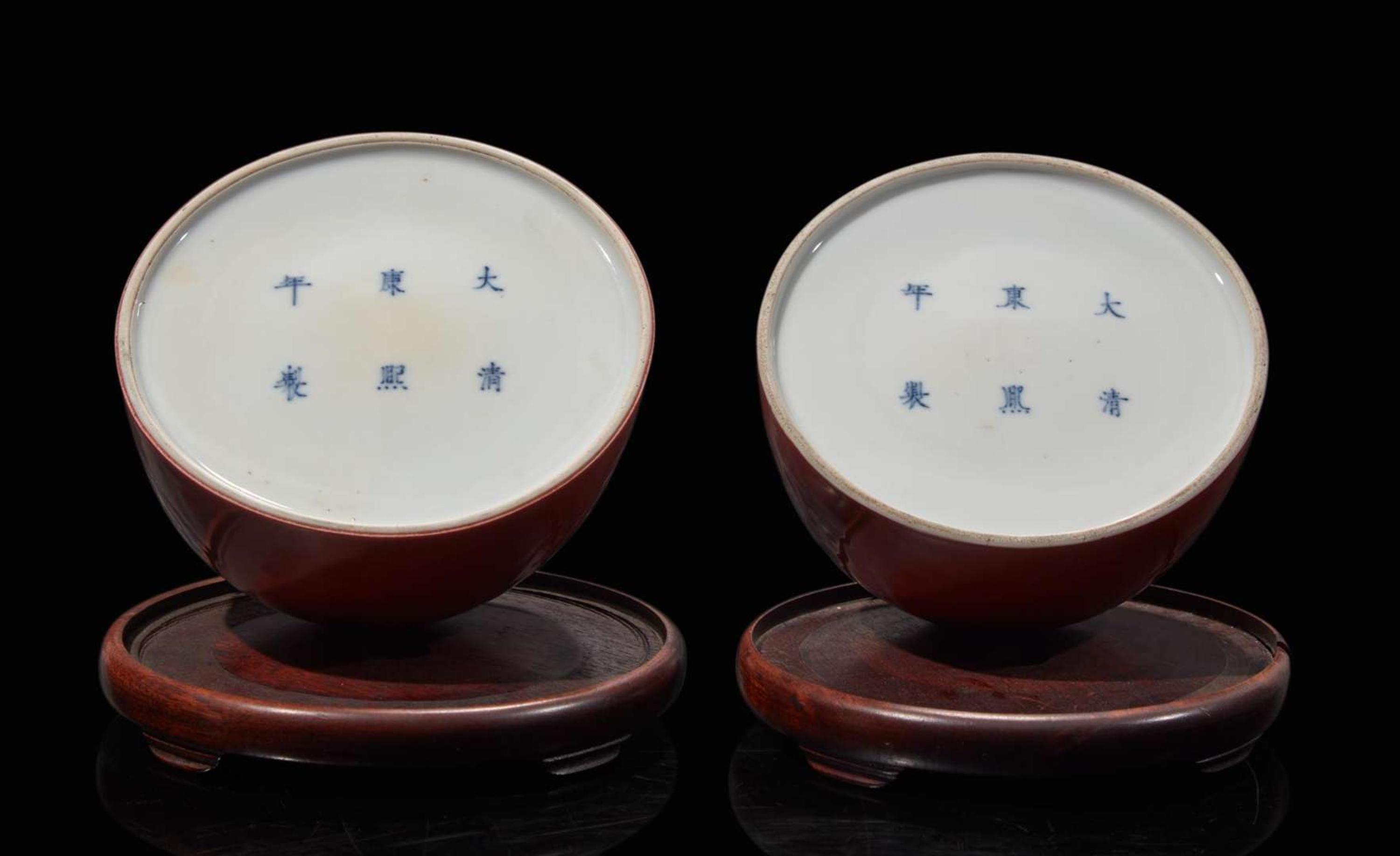 A pair of Chinese iron-red enameled water coupes with hardwood bases 礬紅太白尊一對及木座