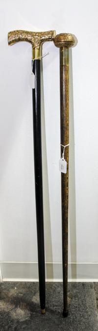 A Group of Two Canes Length of longest 36 5/8 inches.
