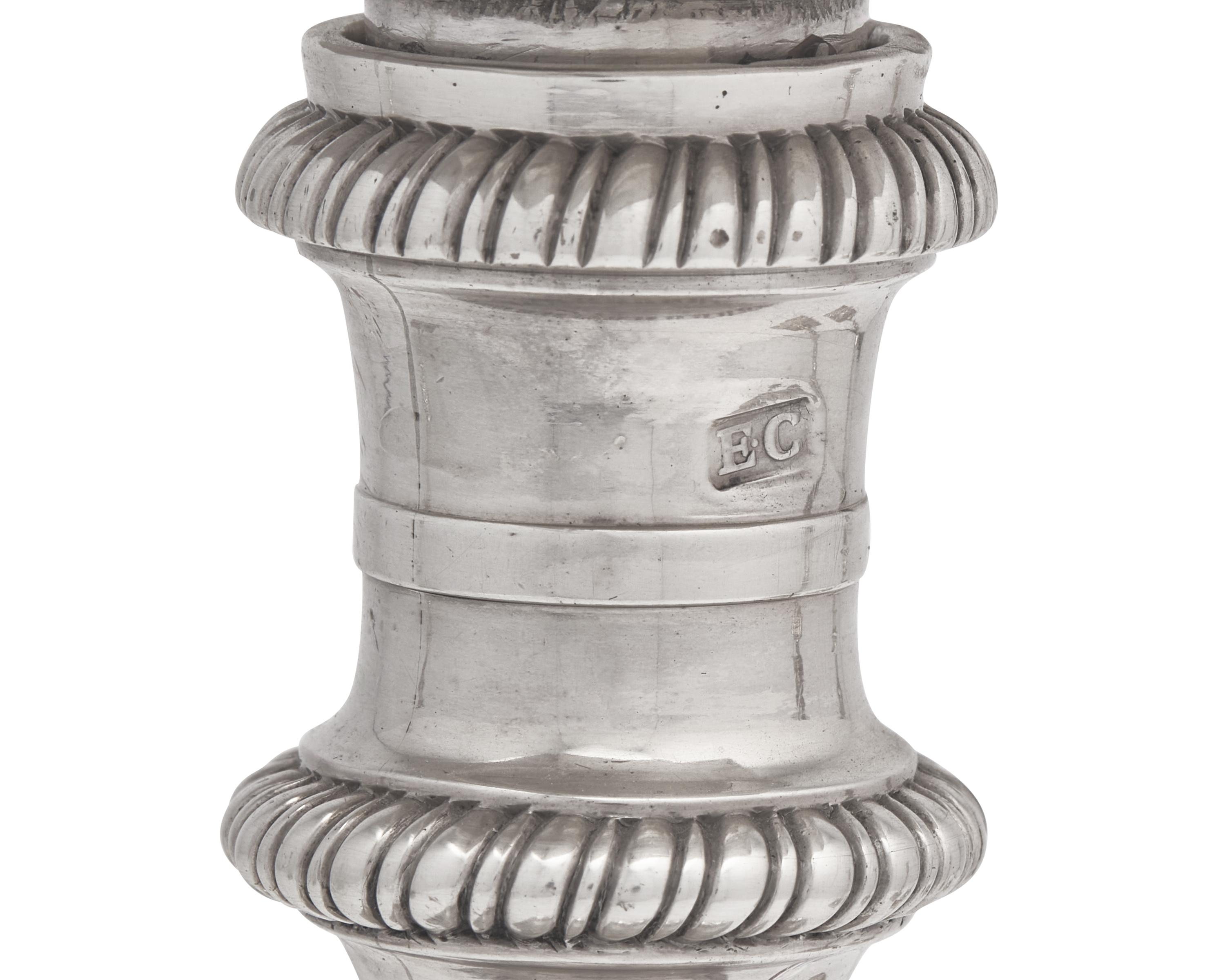 An Assembled Set Of Four George III Sterling Silver Candlesticks