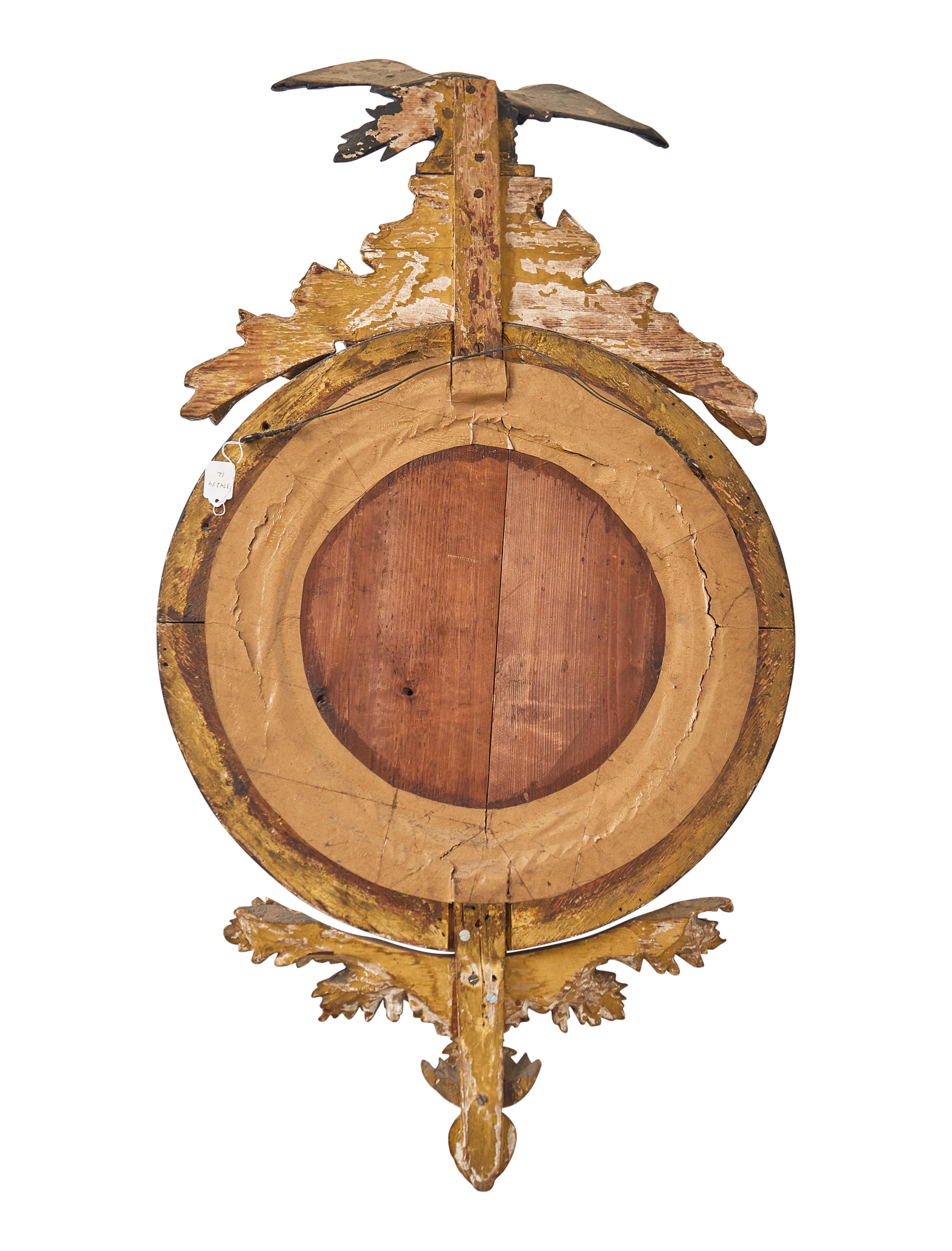 A Regency Giltwood and Part Ebonized Bull's Eye Mirror