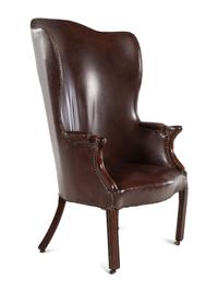 An English Leather Upholstered Mahogany Wingback Armchair