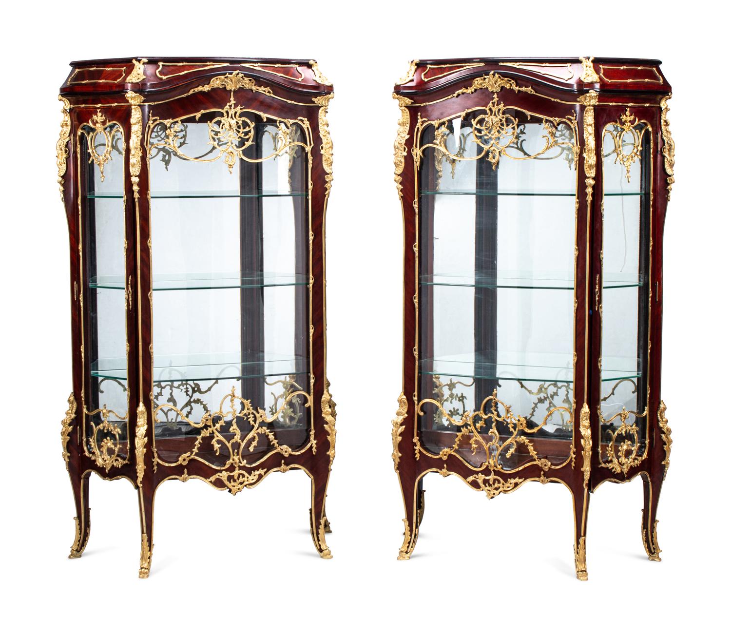 A Pair of Louis XV Style Gilt Bronze Mounted Mahogany Vitrine Cabinets