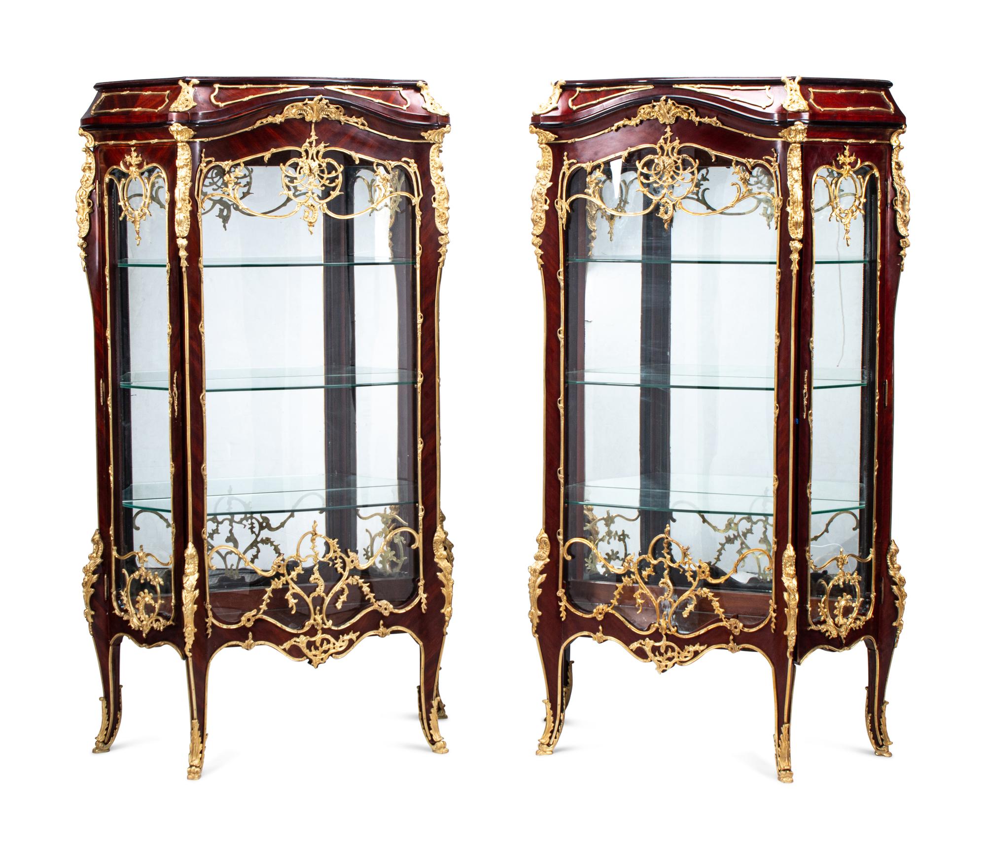A Pair of Louis XV Style Gilt Bronze Mounted Mahogany Vitrine Cabinets
