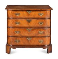 A George III Bookmatch-Veneered Bowfront Chest of Drawers