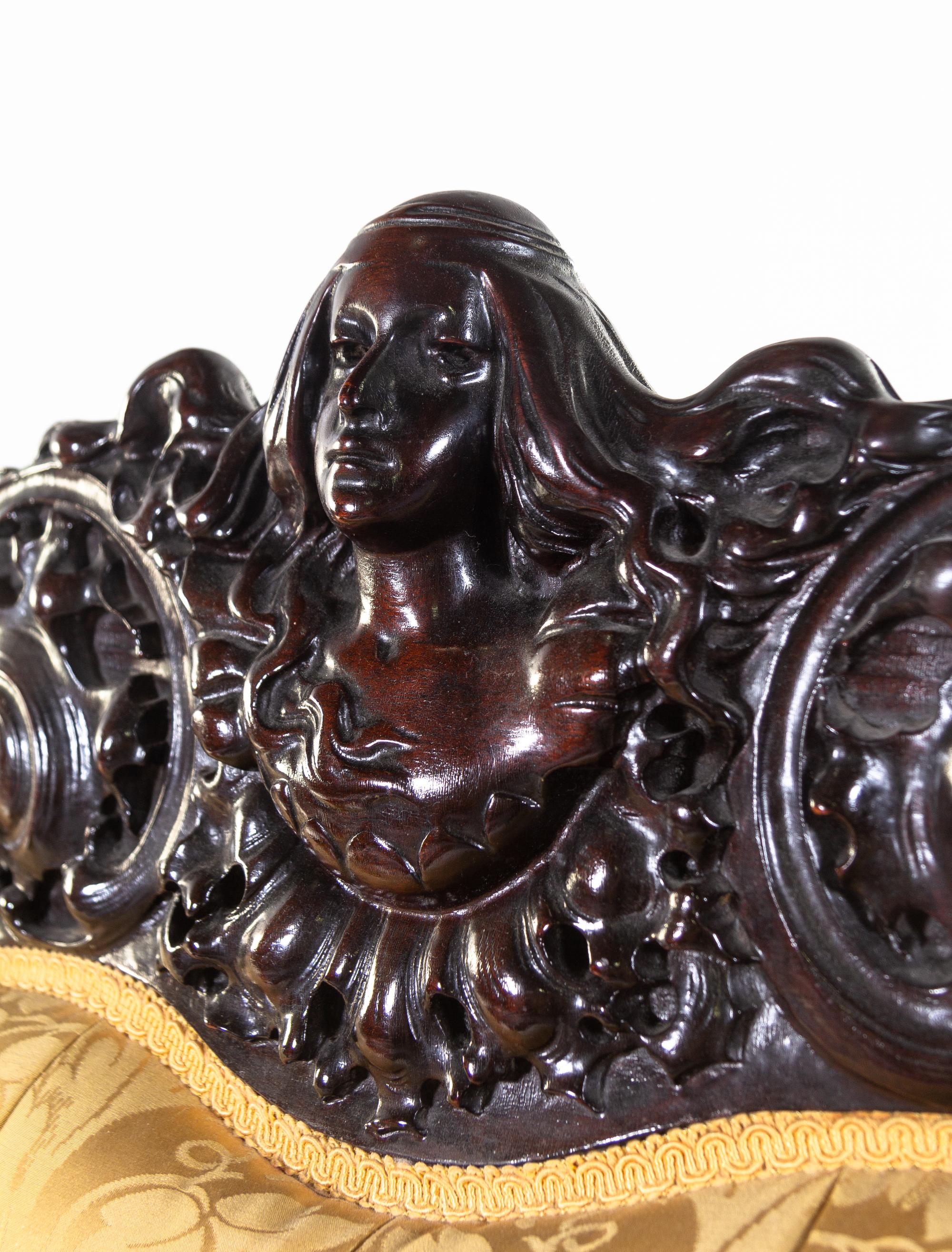 A Karpen Carved Mahogany Three-Piece Parlor Suite