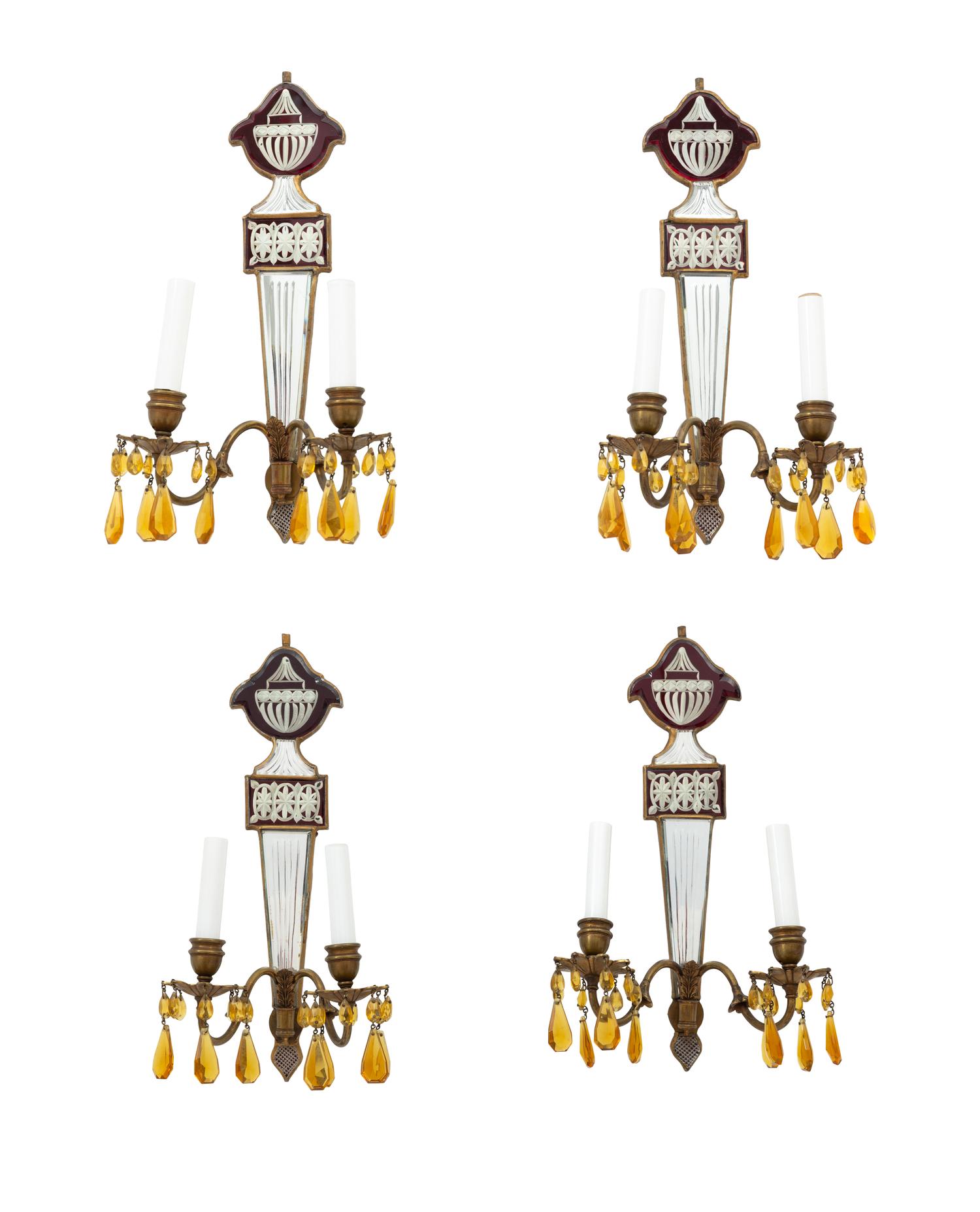 A Set of Four Regency Style Mirrored Two-Light Sconces