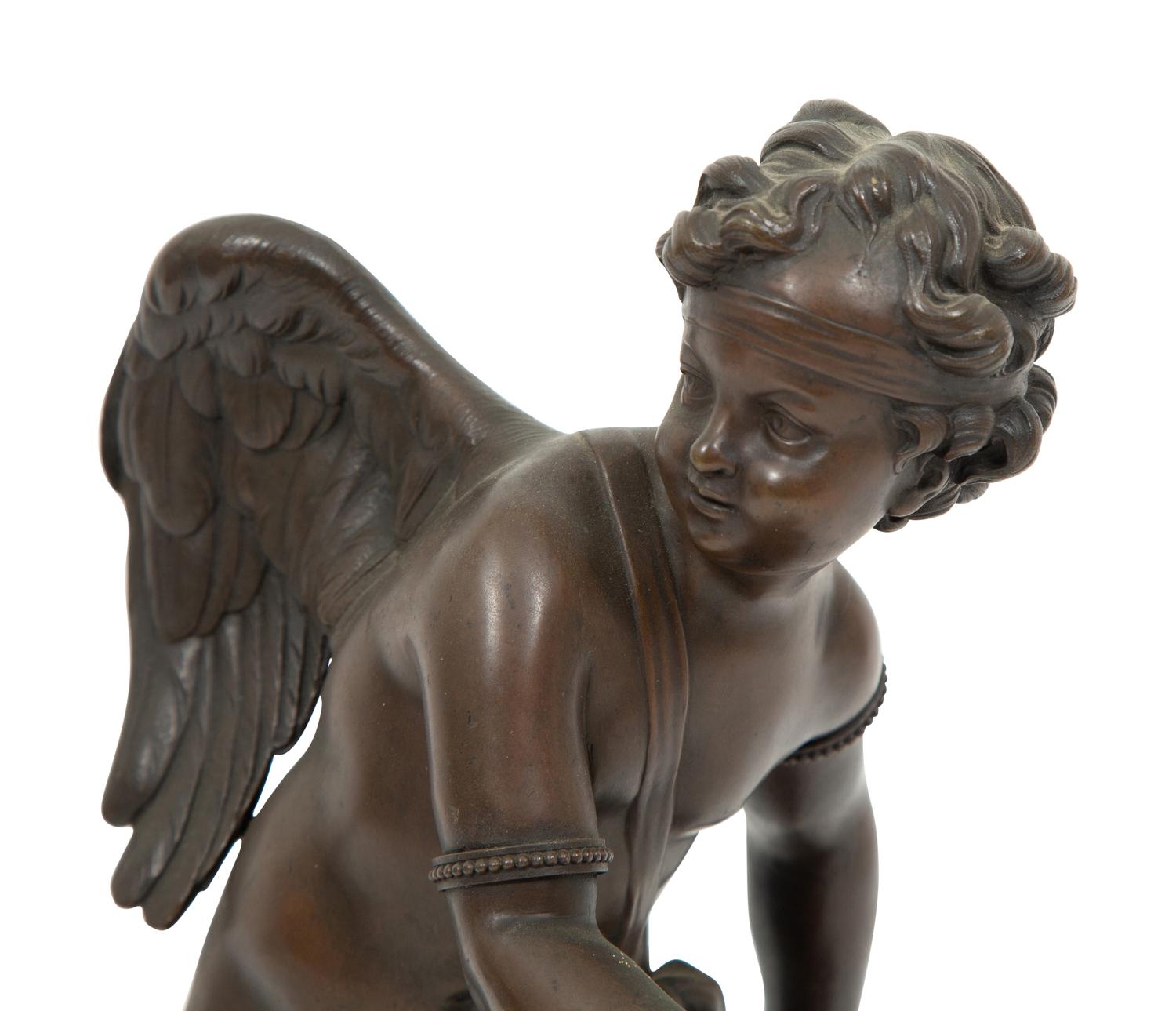 A French Bronze Figure of Eros on a Wood Base