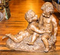 A Terracotta Figural Group. Height 19 1/4 x width 23 inches.