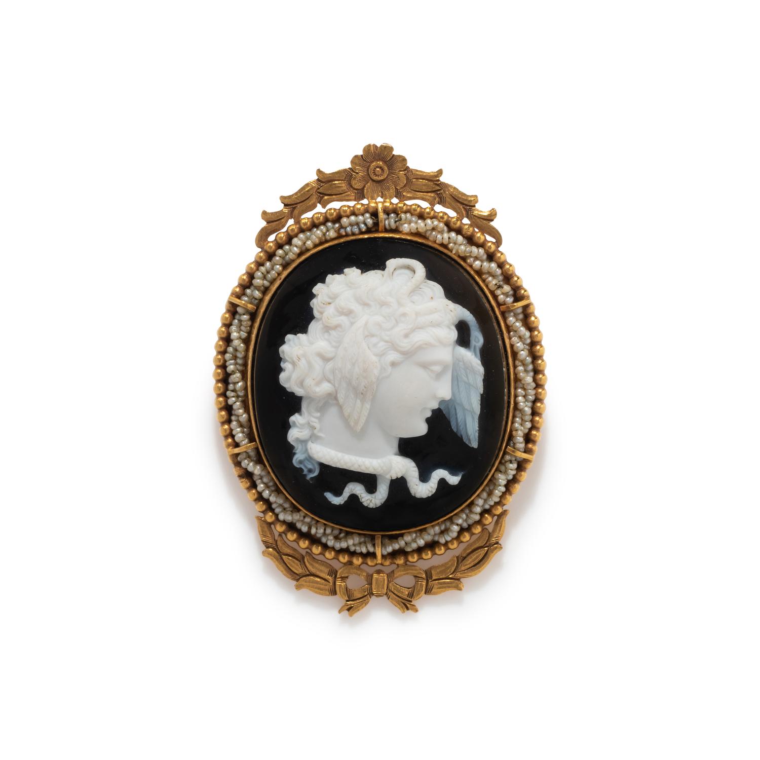 A Neoclassical Gold and Onyx Cameo Brooch with the Head of Medusa
