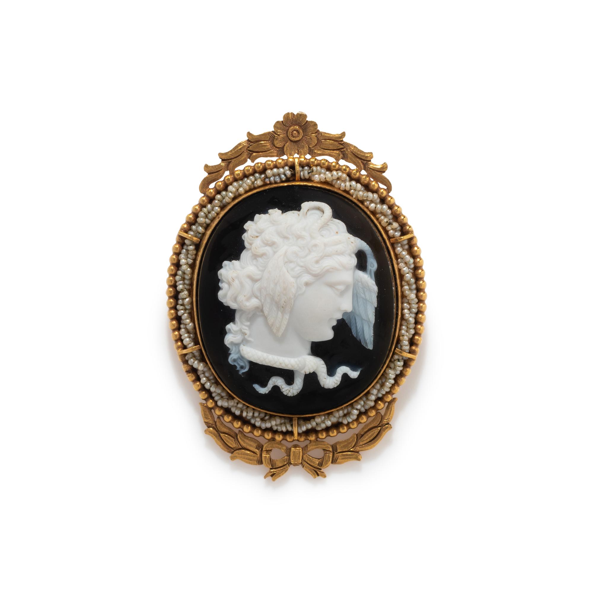 A Neoclassical Gold and Onyx Cameo Brooch with the Head of Medusa