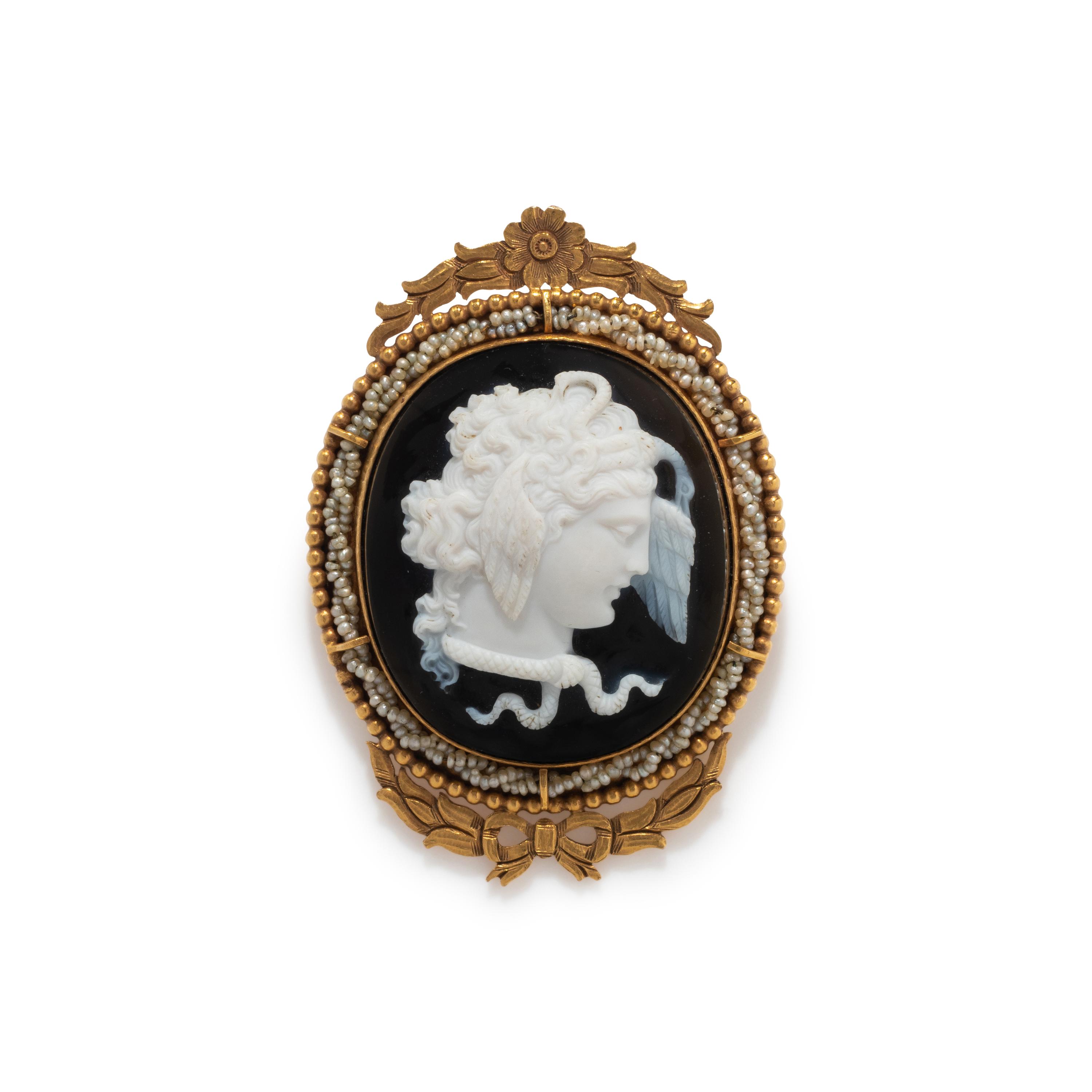 A Neoclassical Gold and Onyx Cameo Brooch with the Head of Medusa