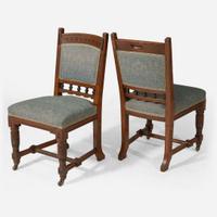 An English Aesthetic Movement carved oak dining table and set of twelve dining chairs Lamb of Manchester, Manchester, England, circa 1875