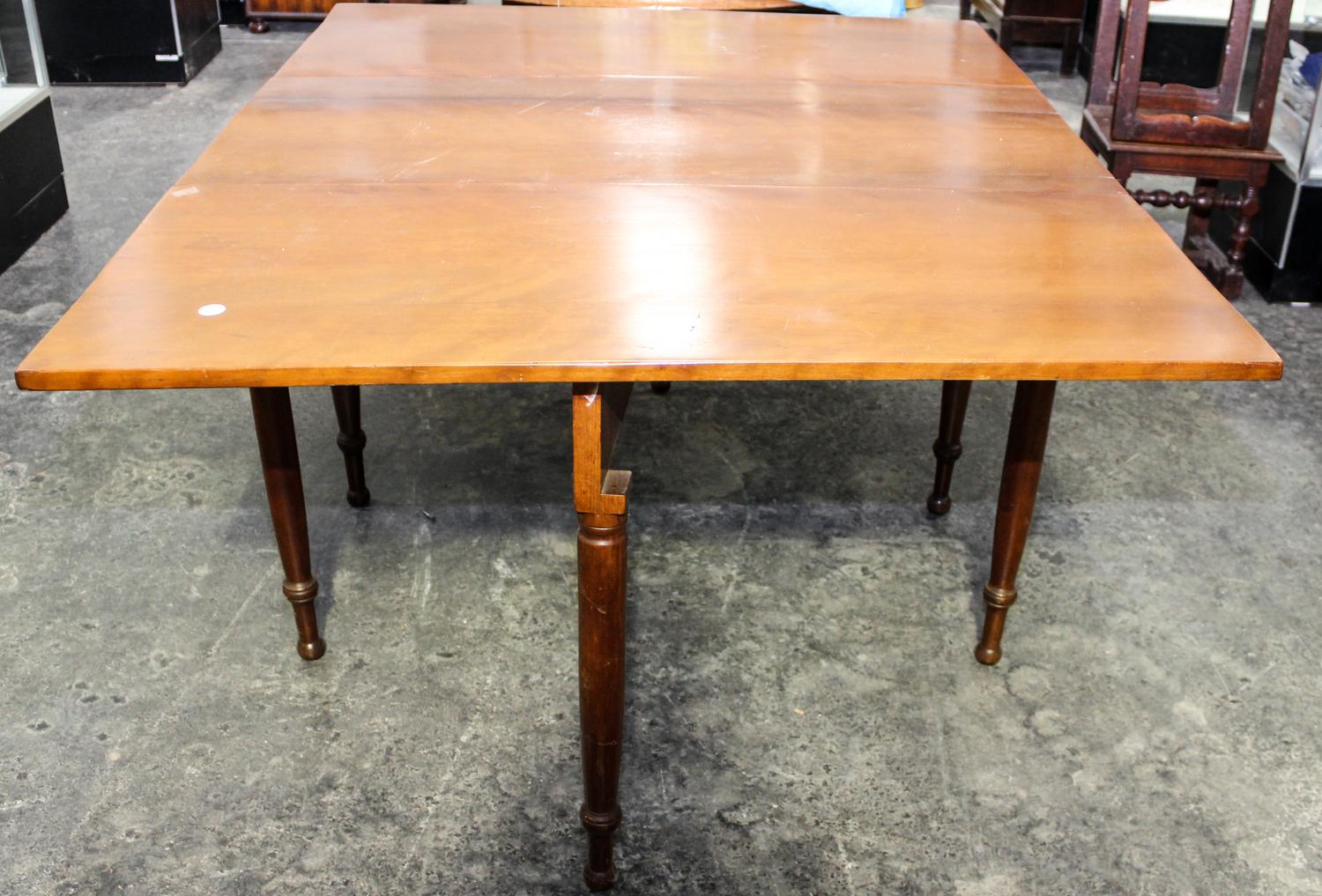 An American Cherry Drop Leaf Table Height 20 1/4 x width 46 x depth 20 3/4 inches (closed). — 19TH CENTURY