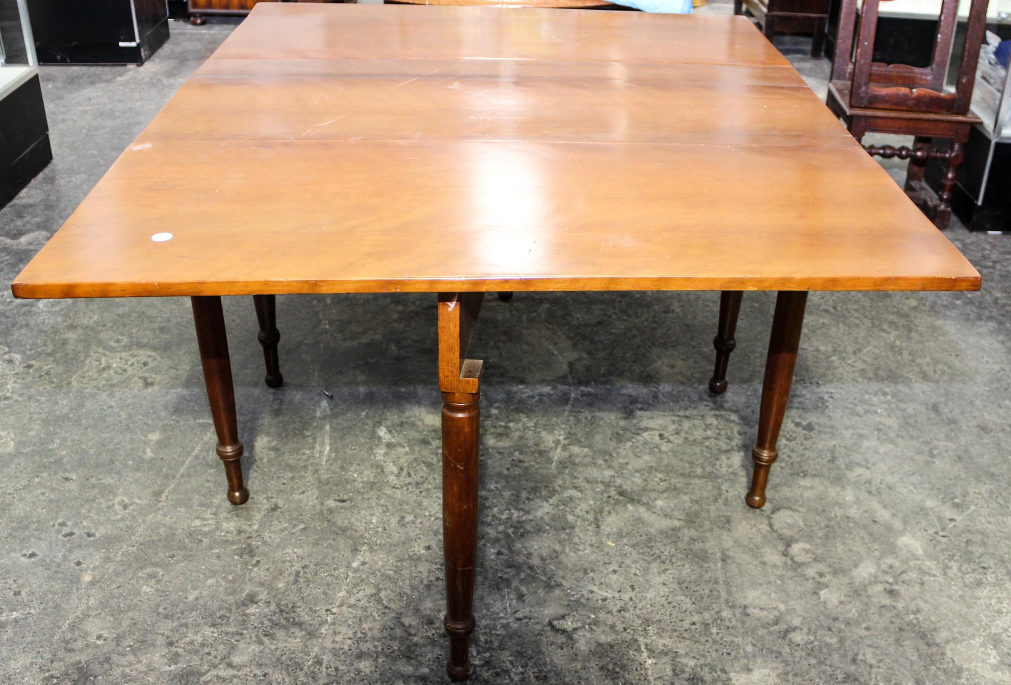 An American Cherry Drop Leaf Table Height 20 1/4 x width 46 x depth 20 3/4 inches (closed). — 19TH CENTURY