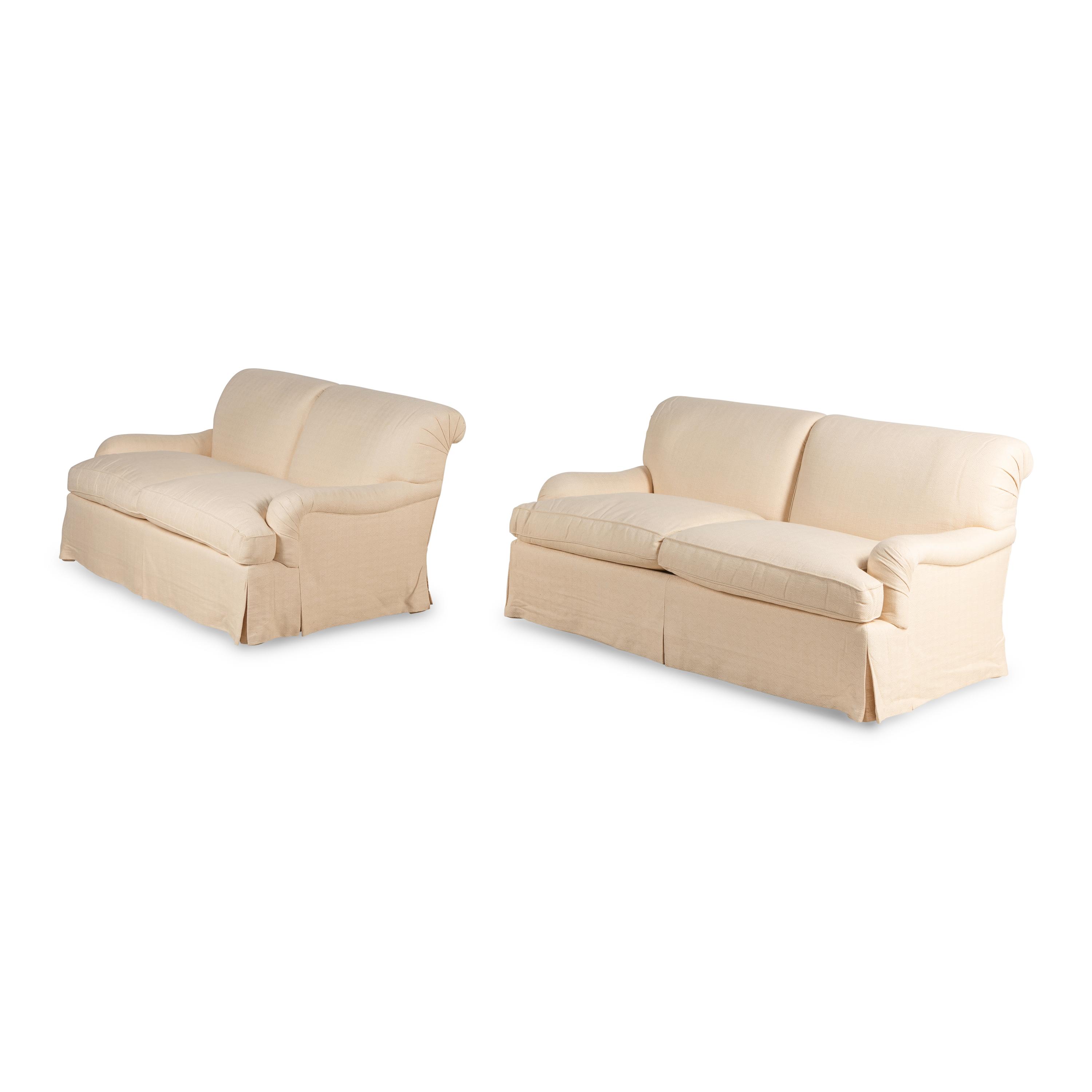 A Pair of Linen-Upholstered Two-Cushion Sofas with Custom Throw Pillows