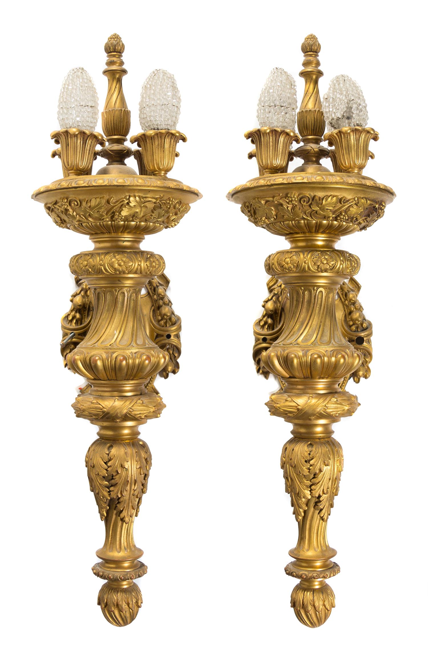 A Pair of Continental Gilt Bronze Four-Light Sconces Height 28 inches.