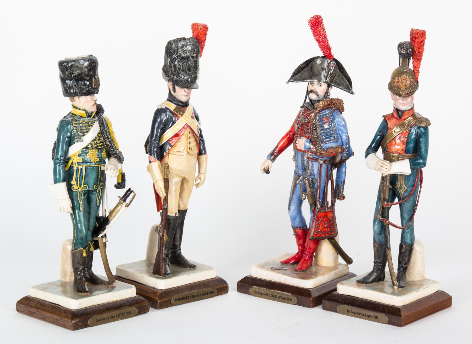 A Group of Four Resin Figures Height of first 10 3/4 inches.