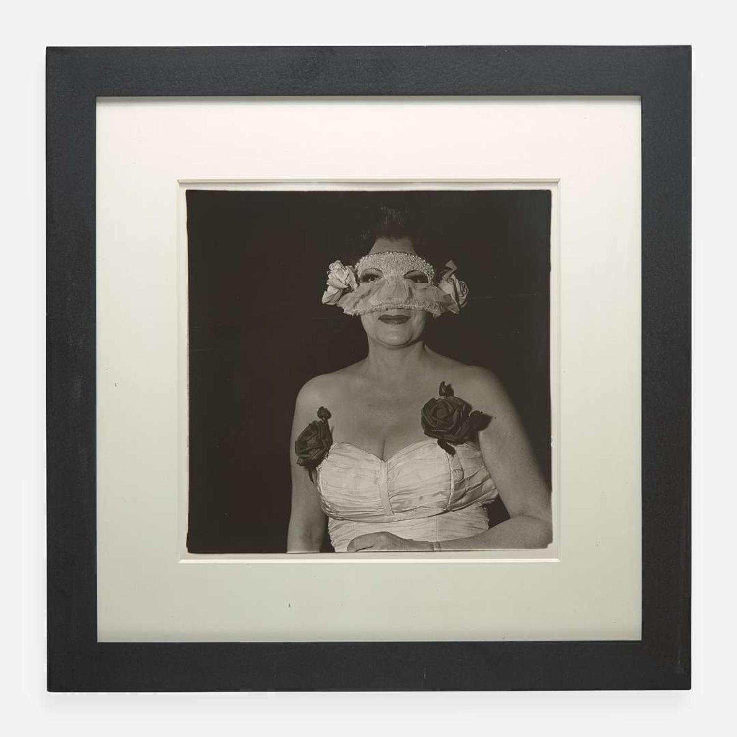Diane Arbus (American, 1923-1971) Lady at a Masked Ball with Two Roses on her Dress, N.Y.C.