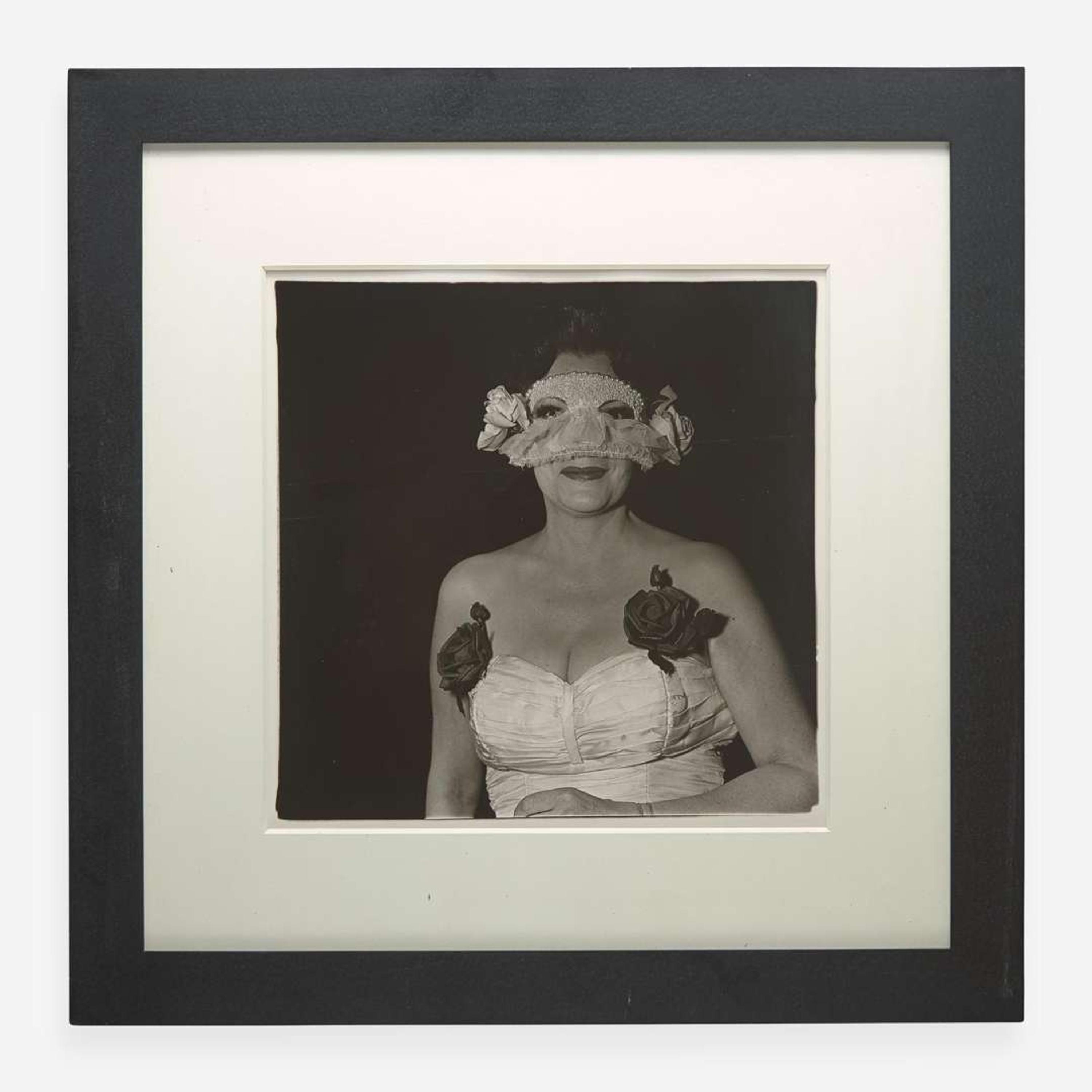 Diane Arbus (American, 1923-1971) Lady at a Masked Ball with Two Roses on her Dress, N.Y.C.