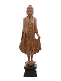 A Burmese Gilt Lacquered Wood Figure of a Standing Buddha — 19TH CENTURY
