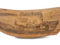 An Unusually Large Scrimshaw Tooth Depicting A Seaport