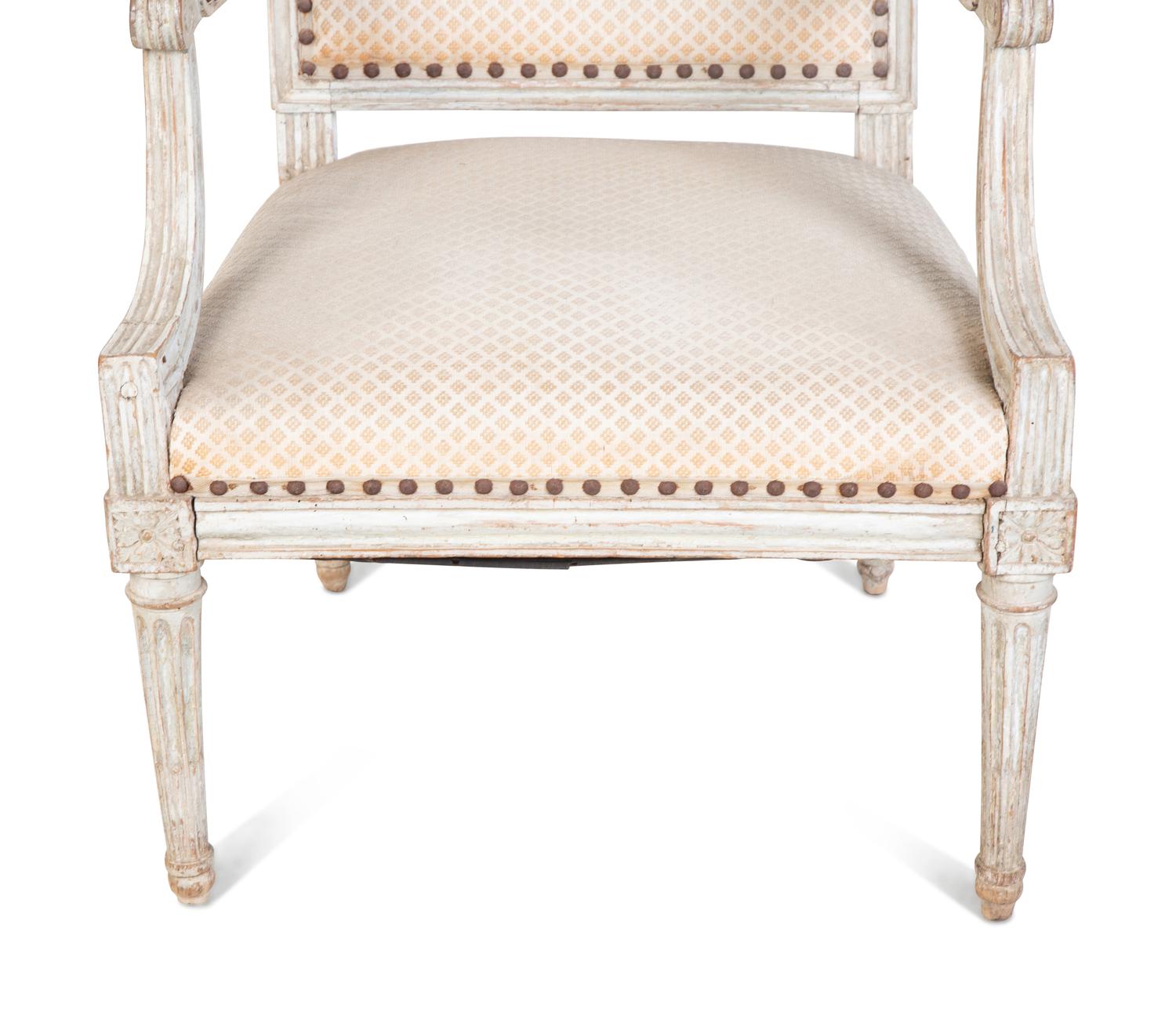 A Louis XVI Style Carved and Painted Fauteuil — 20TH CENTURY