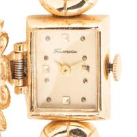 TOURNEAU, YELLOW GOLD, DIAMOND, SAPPHIRE AND CULTURED PEARL SURPRISE WATCH