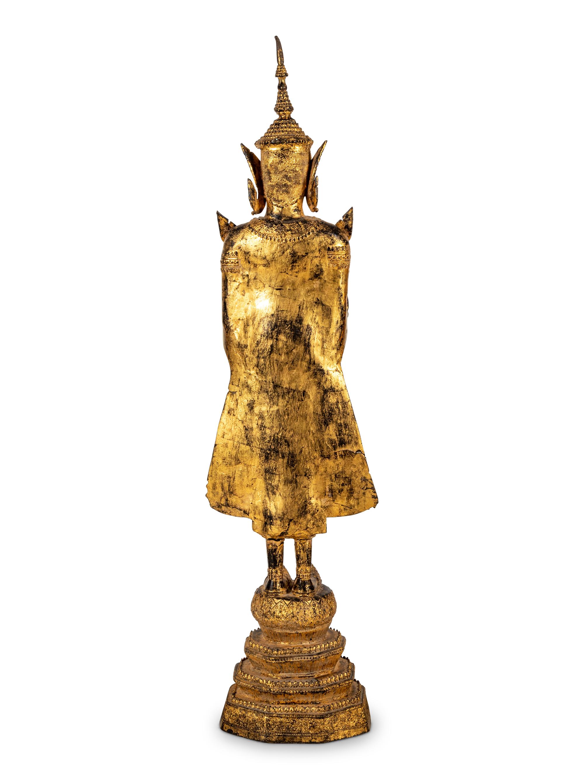 A Large Thai Gilt Bronze Figure of a Standing Deity