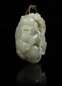A Carved Jade Toggle Length 2 3/4 inches.