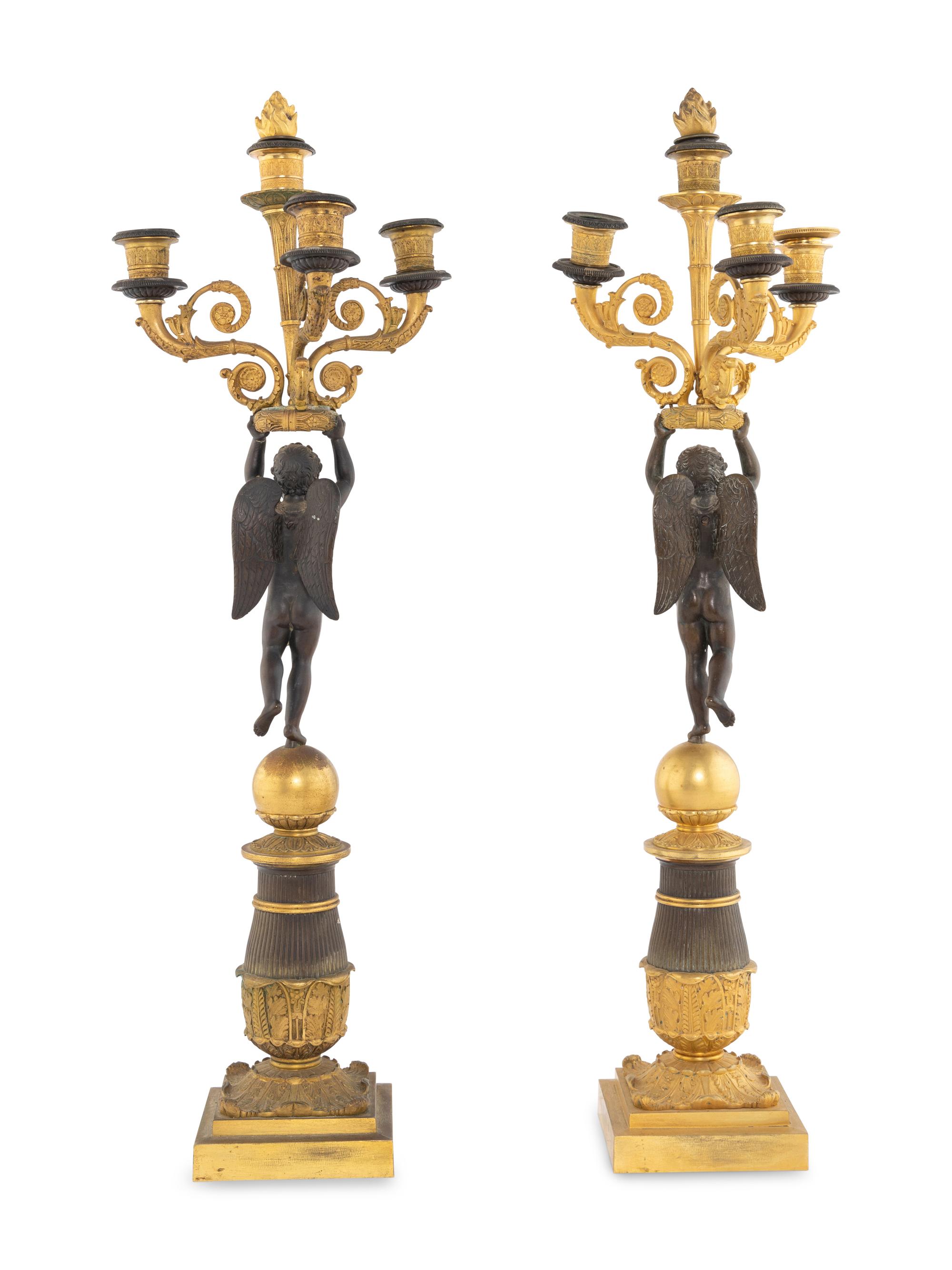 A Pair of Empire Style Gilt and Patinated Bronze Figural Candelabra
